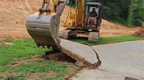 remove concrete slab mini excavator|Mini excavator breaking concrete and digging patio .